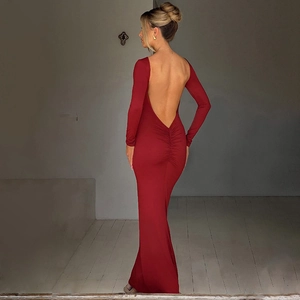 Detail view of backless burgundy slim-fit dress showing deep V neck and elegant tailoring