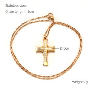 Detailed view of a gold stainless steel cross necklace with zircon and 45cm chain