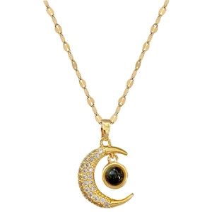 Gold-plated moon pendant necklace with micro-pave crystals and center projection stone