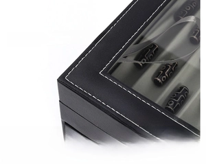 Detailed close-up of premium black PU leather watch box with white stitching and clear window