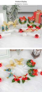 Close-up of mini Christmas cake toppers with festive wreaths and holly berries