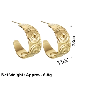Detail view of gold C-shaped earrings with sun pattern engraving and 2.3cm height spec
