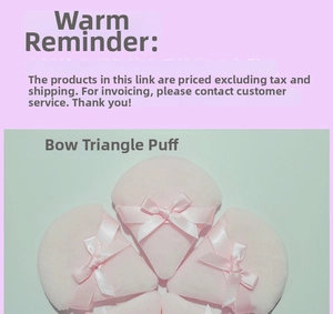 Detail of triangular velvet powder puffs in light pink with decorative ribbon bows