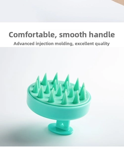 Detail of mint green silicone scalp massager with ergonomic handle and soft bristles