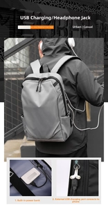 Detail view of business laptop backpack featuring external USB port and earphone jack