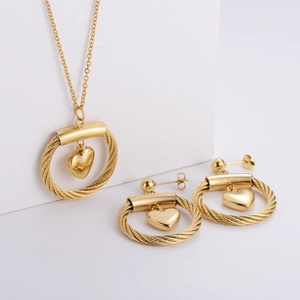 Elegant gold titanium steel jewelry set featuring heart charms and twisted rope rings