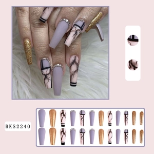 Long coffin press-on nails set featuring purple matte, gold glitter, and marble designs