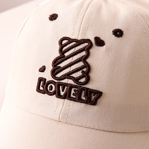 Close-up of cute bear and LOVELY embroidery on kids beige cotton baseball cap