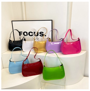 Macro display of candy-colored glossy patent leather shoulder bags in eight vibrant shades