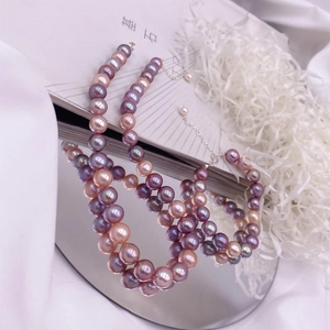 Elegant Baroque freshwater pearl necklace with purple and pink Edison pearls and silver clasp