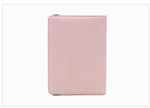Close-up of pink faux suede RFID passport holder with precision edge stitching