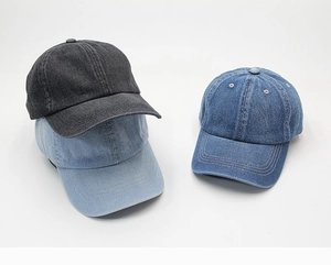 Detailed view of three vintage denim baseball caps in charcoal, light blue, and classic navy