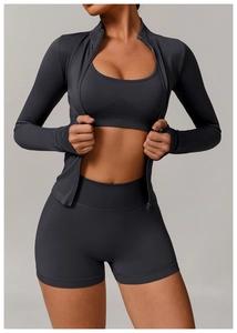 Detailed view of 3-piece charcoal grey seamless yoga set with jacket and high-waist shorts