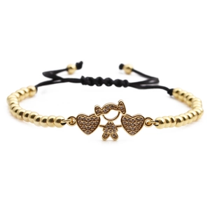 Adjustable woven bracelet with gold girl charm and zircon heart pendants on black string