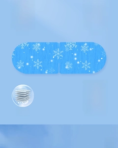 Detail of blue cooling eye mask with snowflake patterns and wide elastic ear loops