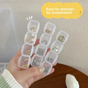 Detailed view of a 12-grid transparent jewelry box with removable 4-slot compartments