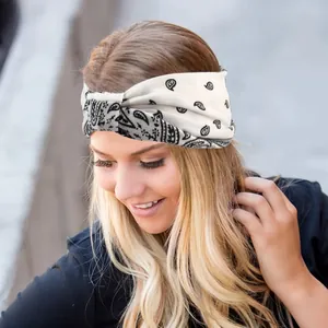 Close-up of high-elastic paisley twisted headband on a model in natural outdoor lighting