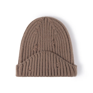 Distressed dark brown knit beanie with irregular ripped details and ribbed texture