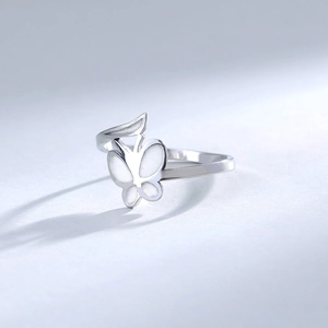 Detailed side view of 304 stainless steel butterfly ring with white inlay and silver finish