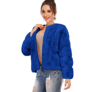 Detail of royal blue faux fur cropped jacket with soft texture and long sleeve design