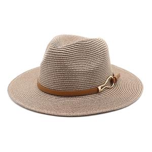 Close-up of khaki woven straw fedora featuring a slim brown leather band and gold buckle