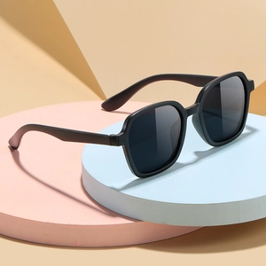 Classic retro black square kids sunglasses with dark grey polarized lenses on a geometric base