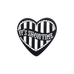 Creative heart-shaped black and white enamel pin featuring IT'S SHOWTIME slogan