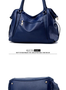 Detailed view of the blue litchi pattern leather tote bag back with zipper pocket and studs