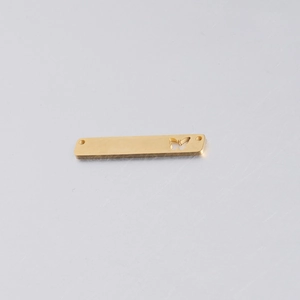 Detailed view of gold rectangle butterfly hollow pendant with dual DIY holes