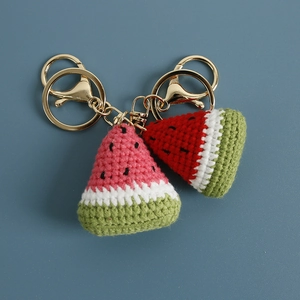 Handmade crochet watermelon keychains with two colorful fruit slices and gold ring