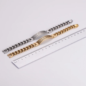 Detail view of 21cm gold and silver Cuban NK link bracelets with geometric patterns