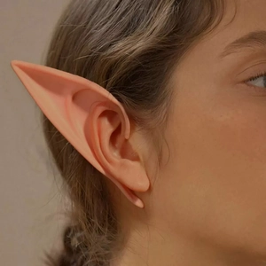 Close-up of realistic flesh-pink latex elf ears for Halloween cosplay costumes