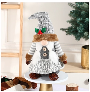 Close-up of a plush Christmas gnome with holly berries on a minimalist display stand