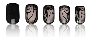 Detail of five black and gray press-on nails with swirl patterns and small rhinestones