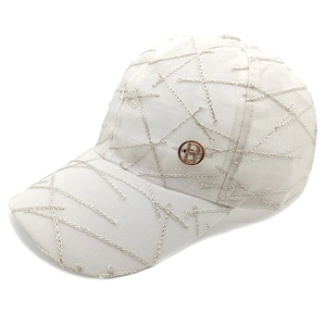 White baseball cap with silver embroidery and gold metal R logo on breathable mesh fabric