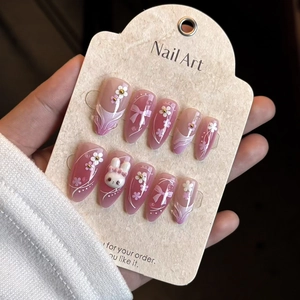 Pink and purple gradient almond press-on nails with 3D bunny and bow accents