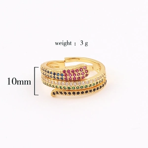 Macro detail of gold snake ring with colorful zircon stones and 10mm width measurements