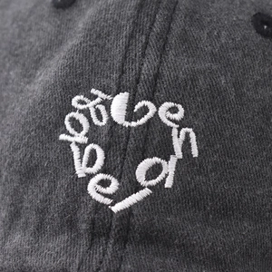 Distressed dark grey washed cotton baseball cap with white heart alphabet embroidery