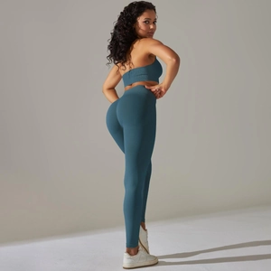 Detailed texture of seamless ribbed knit yoga set in deep teal for sports and fitness