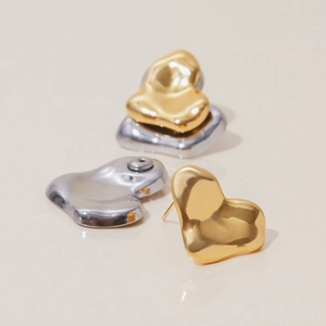 Minimalist liquid metal heart-shaped earrings in polished gold and silver finish