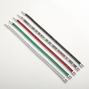 Close-up of 18K gold stainless steel bracelets with multi-color rectangular cubic zirconia