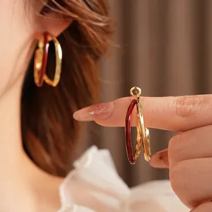 Vintage gold and burgundy double hoop earrings with a minimalist geometric design