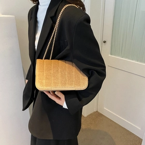 Golden velvet chain shoulder bag for women featuring vertical quilted stitching details