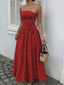 Detailed view of red polka dot off-shoulder maxi dress with elegant high-waist A-line cut