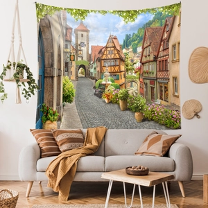 Detailed European town scenery tapestry shown in a cozy living room wall setting