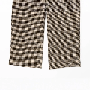 Women's houndstooth cargo pants featuring black and brown fabric textures and cuff details