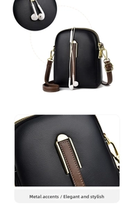 Detail view of mini black lychee leather crossbody bag with brown strap and gold hardware