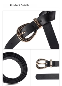Detail of a black leather belt with a vintage golden oval buckle and embossed bead edges