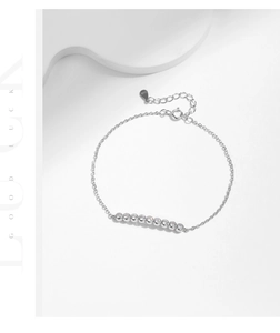 Detail of S925 sterling silver bracelet with ten sparkling round moissanite stones