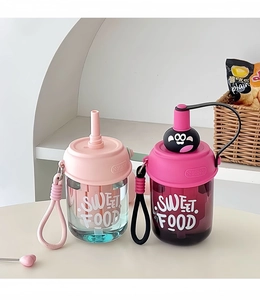 Detail of cute portable water bottles with straws and lanyards in pink and purple colors